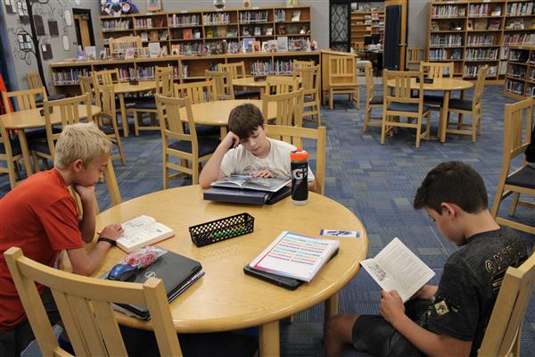 students reading in the library